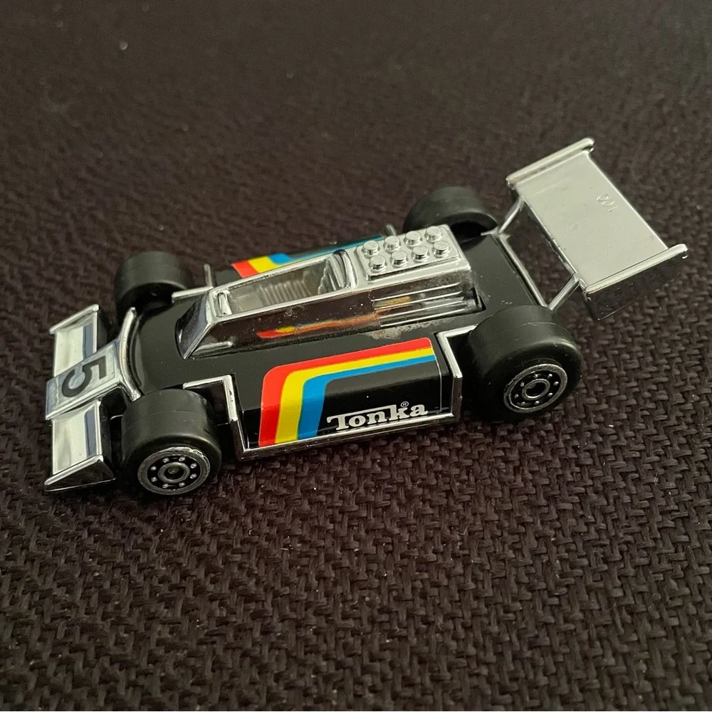 VTG 1979 Tonka black F1 race car w/ rainbow racing stripes